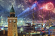Fireworks Over Illuminated Cityscape At Night