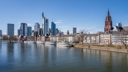 Frankfurt, Germany - March 31, 2020: view on frankfurt skyline and dom from main riverside during springtime