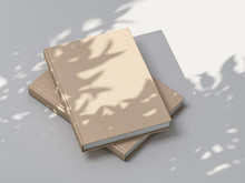 Two Beige Books Mockup With Textured Kraft Hardcover On White Table Outdoor