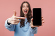 © Drobot Dean - Image of attractive young woman smiling and holding cellphone