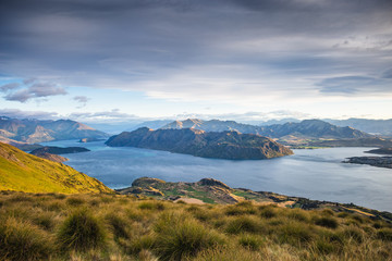 Wall Mural - Roys peak mountain hike in Wanaka New Zealand. Popular tourism travel destination. Concept for hiking travel and adventure. New Zealand landscape background.	