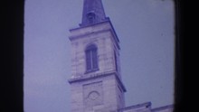SAINT LOUIS MISSOURI-1964: View Of Gold Cross On Top Of Grey Church Spire On A Clear Day