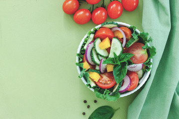 Green salad with tomato and fresh vegetables