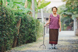 Healthy eldery people walking with tripods cane as adaptive device for fall prevention. Older adults and family caregivers should concern for reduce falls risk factors.