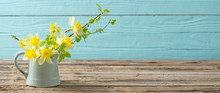 Yellow Spring Flowers On Old Wooden Background