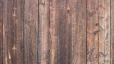 Fototapeta Desenie - pink-brown wood of old untreated boards in the fence structure