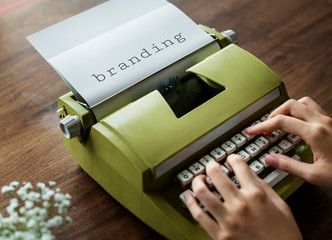 Wall Mural - Aerial view of a man typing on a retro typewriter