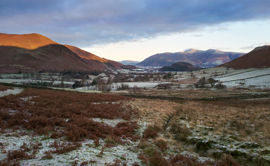 Wall Mural - A frost covered valley of Newlands with a winters sunrise catching the mountain top of Causey Pike, Derwent Fells in the Lake District.