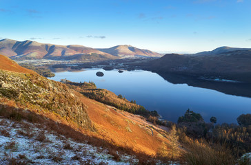 Sticker - Sunrise over Derwent Water near Keswick with the summits of Skiddaw and Blencathra in the distance from below Maiden Moor on a cold winters morning in the Lake District.