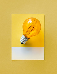 Canvas Print - Colorful light bulb on a paper