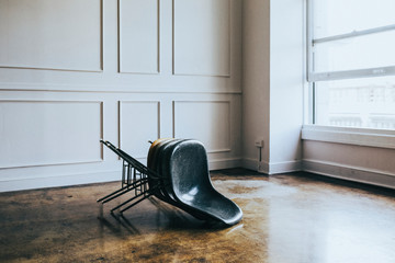 Wall Mural - Stacked chairs in an empty room