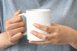 © KPPWC - closeup of women hand holding white ceramic a mug mockup with clipping path