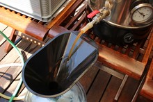 Craft Beer Being Brewed Outside. Home Brewing Concept