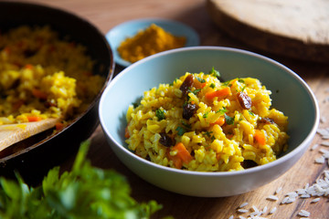 Wall Mural - Yellow curry rice with vegetables and raisins