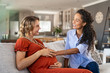 © Rido - Excited friend touching belly bump of pregnant woman