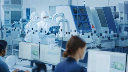 Poster - In Clean Workshop: Professional Workers in Coveralls and Masks Use Laptop and Talk. Inside Factory Office: Female Electronics Engineer Works on Computer, Screen Shows Printed Circuit Board 3D Design