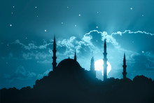 A Silhouette Of A Big Mosque On Blue Full Moon In Night Background. Ramadan Concept.