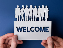 Hands Holding A Welcome White Card Business Team People Sign