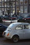 Fototapeta Miasto - A car parked near an Amsterdam canal