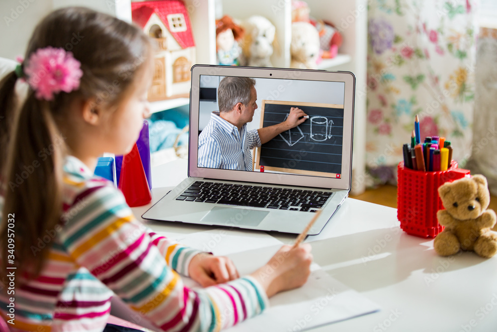 Middle-aged distance teacher having video conference call with pupil using webcam. Online education and e-learning concept. Home quarantine distance learning and working from home. - obrazy, fototapety, plakaty 