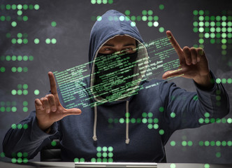 young hacker in data security concept