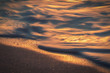 © Victor Prieto/ADDICTIVE STOCK - Foamy sea water waving near wet sandy beach of Cala Conta during sundown on Ibiza, Spain