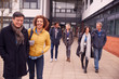 © Monkey Business - Group Of Smiling Mature Students Walking Outside College Building