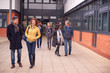 © Monkey Business - Group Of Smiling Mature Students Walking Outside College Building