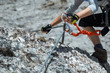 © Piotr - Climbing along a steel line on the via ferrata route in the dolomites