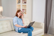 © andrey - female freelancer communicates via video online.