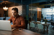 © mavoimages - Businessman working on his laptop after hours in an office