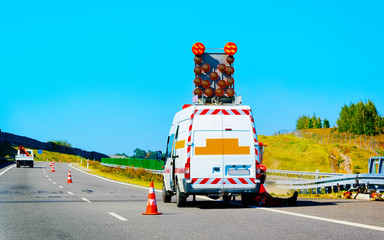 Canvas Print - Mini van carrying traffic road sign highway road Slovenia reflex