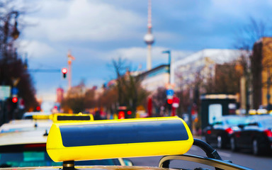 Wall Mural - Taxi sign board on street of Berlin Germany reflex