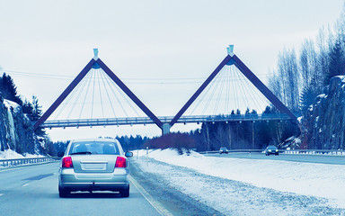 Canvas Print - Car and bridge in road in winter Rovaniemi reflex