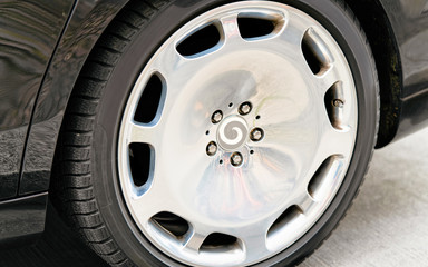 Canvas Print - Car tire on road in Berlin reflex