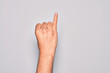 © Krakenimages.com - Hand of caucasian young man showing fingers over isolated white background showing little finger as pinky promise commitment, number one