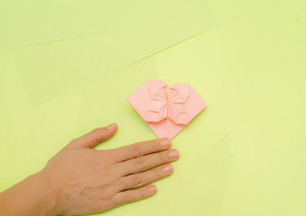 Origami pink heart on a green background, step by step instructions. as great idea for a hand made diy Valentine s Day, Mothers day gift. Step 23