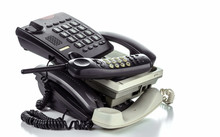 Old Desk Phones And Cordless Phone Isolated On A White Background.
