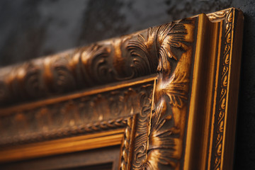 Sticker - Beautiful golden frame on black wall with pattern close up