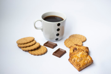 coffee, cookies and chocolate on a white background