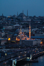 Yeni Cami Mosque By Buildings In City At Dusk