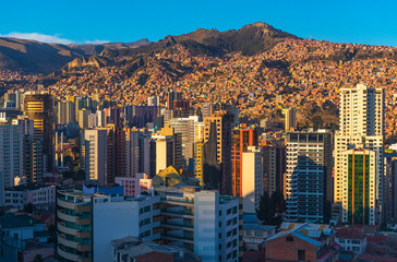 Wall Mural - Cityscape of La Paz with its modern urban skyline and skyscrapers at sunset, Andes Mountains, Bolivia.