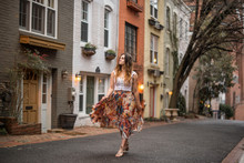 Female Traveler Walking The Colorful Streets Of Downtown Georgetown In Washington DC