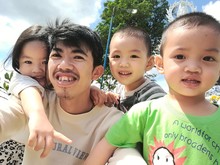 Portrait Of Smiling Father With Children