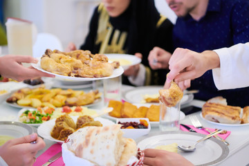 Wall Mural - muslim family having a Ramadan feast