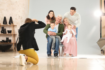 Wall Mural - Photographer working with family in studio