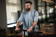 © JustLife - Young man on e-scooter. Businessman driving electric scooter in office.