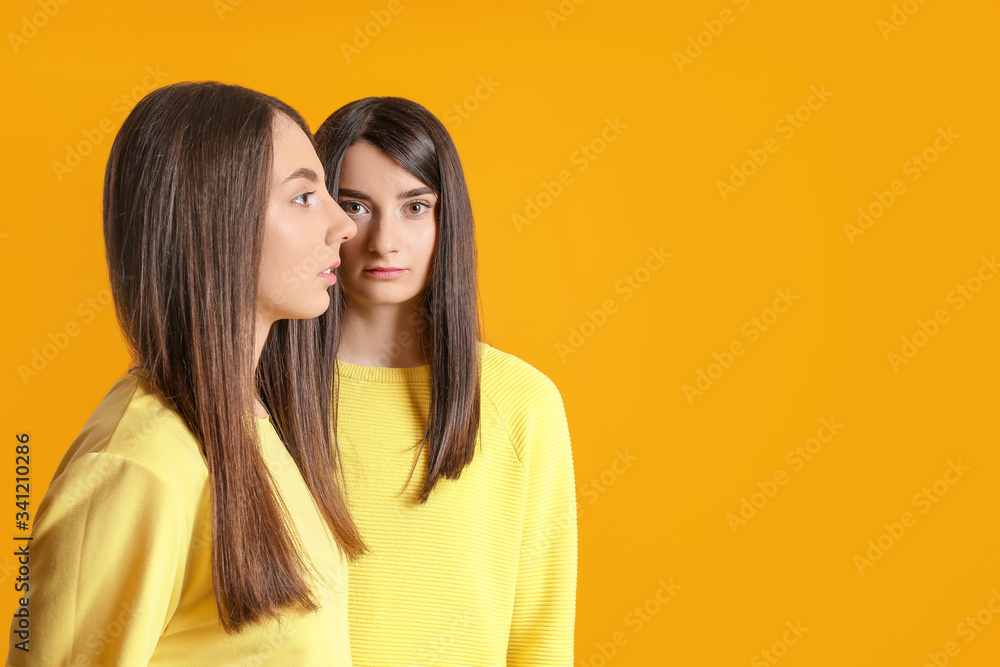 Stylish young women on color background