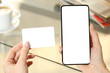 © PheelingsMedia - Woman hands holding credit card and blank phone screen
