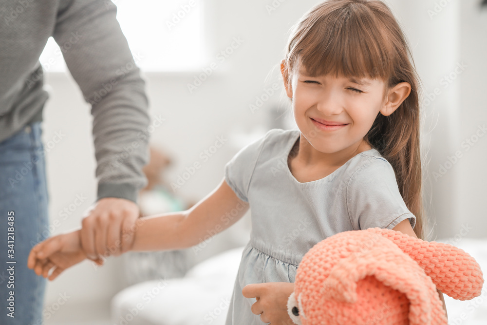 Angry father threatening his daughter at home
